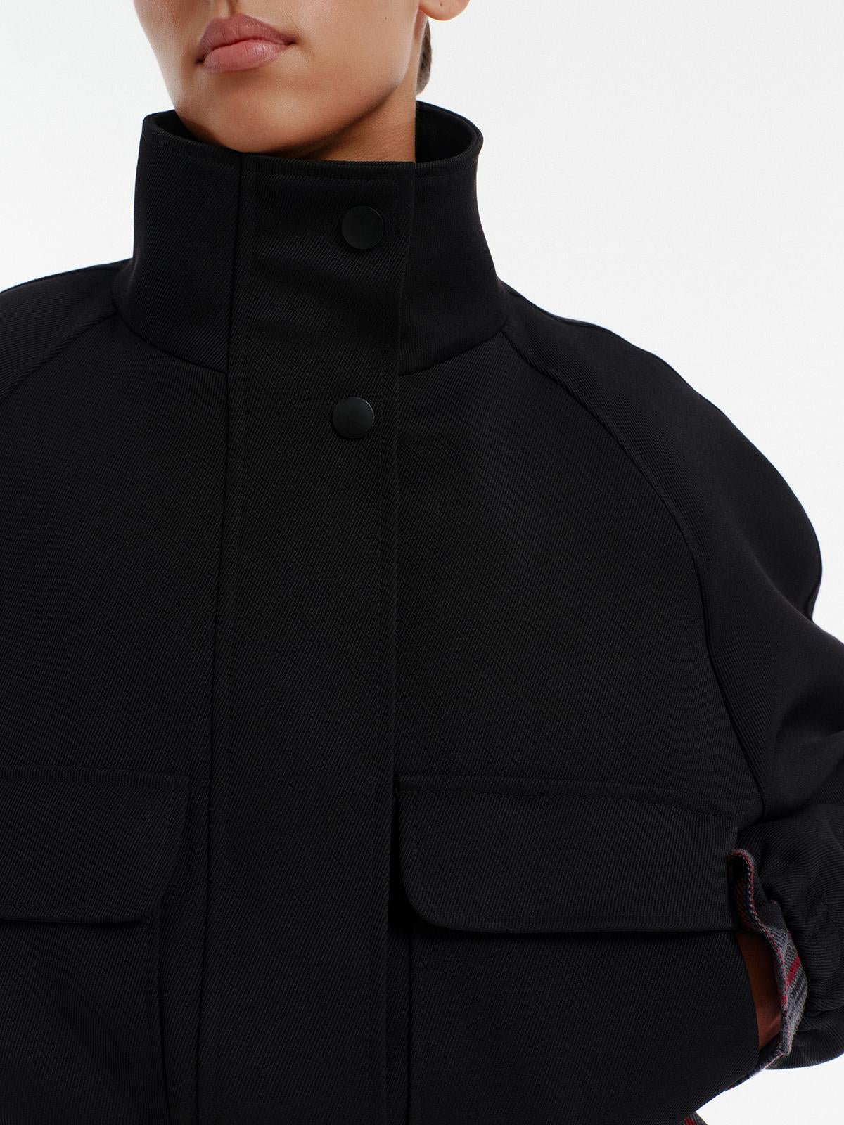High neck insulated bomber jacket in black structured virgin wool