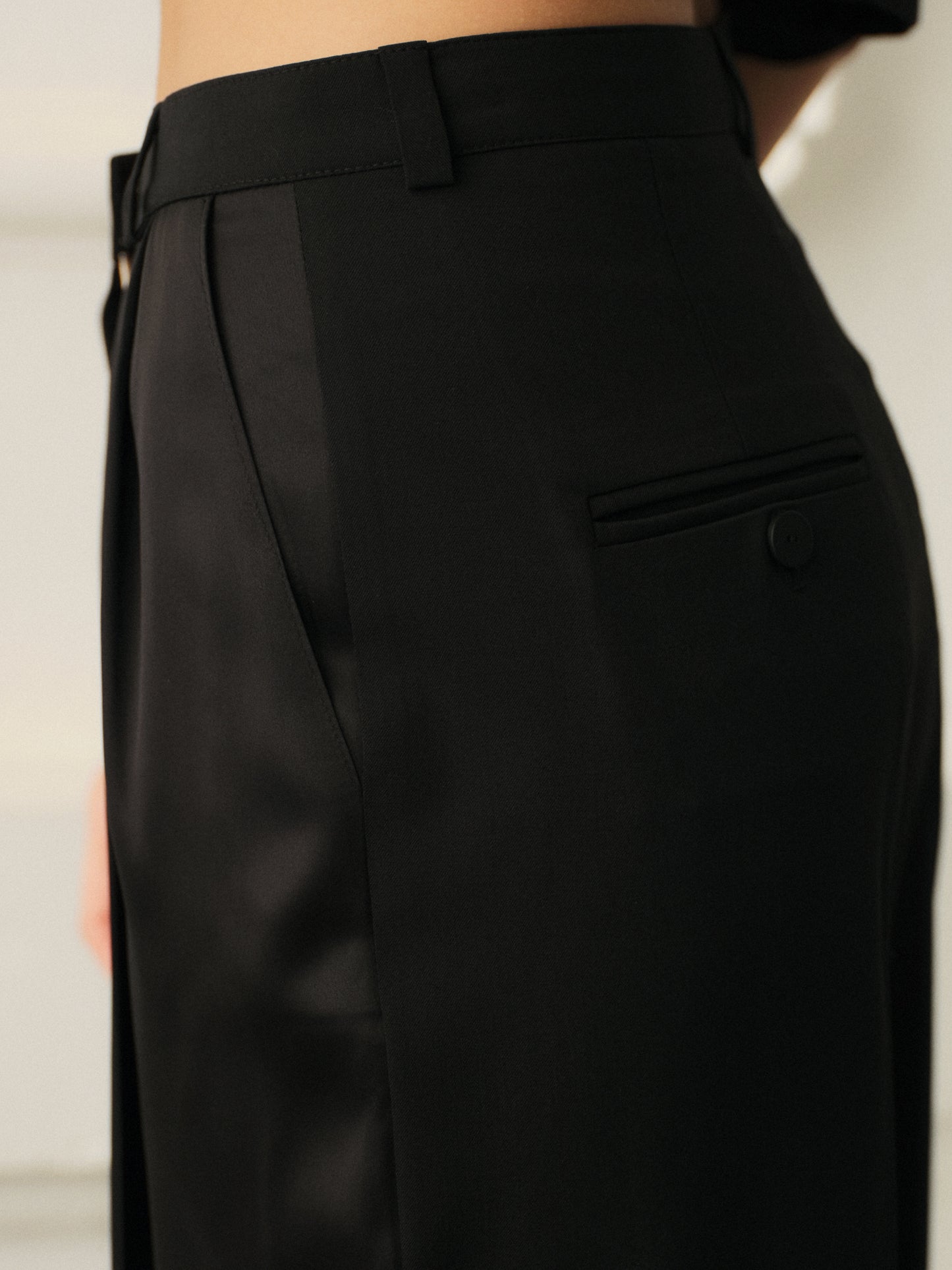 Wide leg pants and oversized crop top in fine black wool with contrast satin front