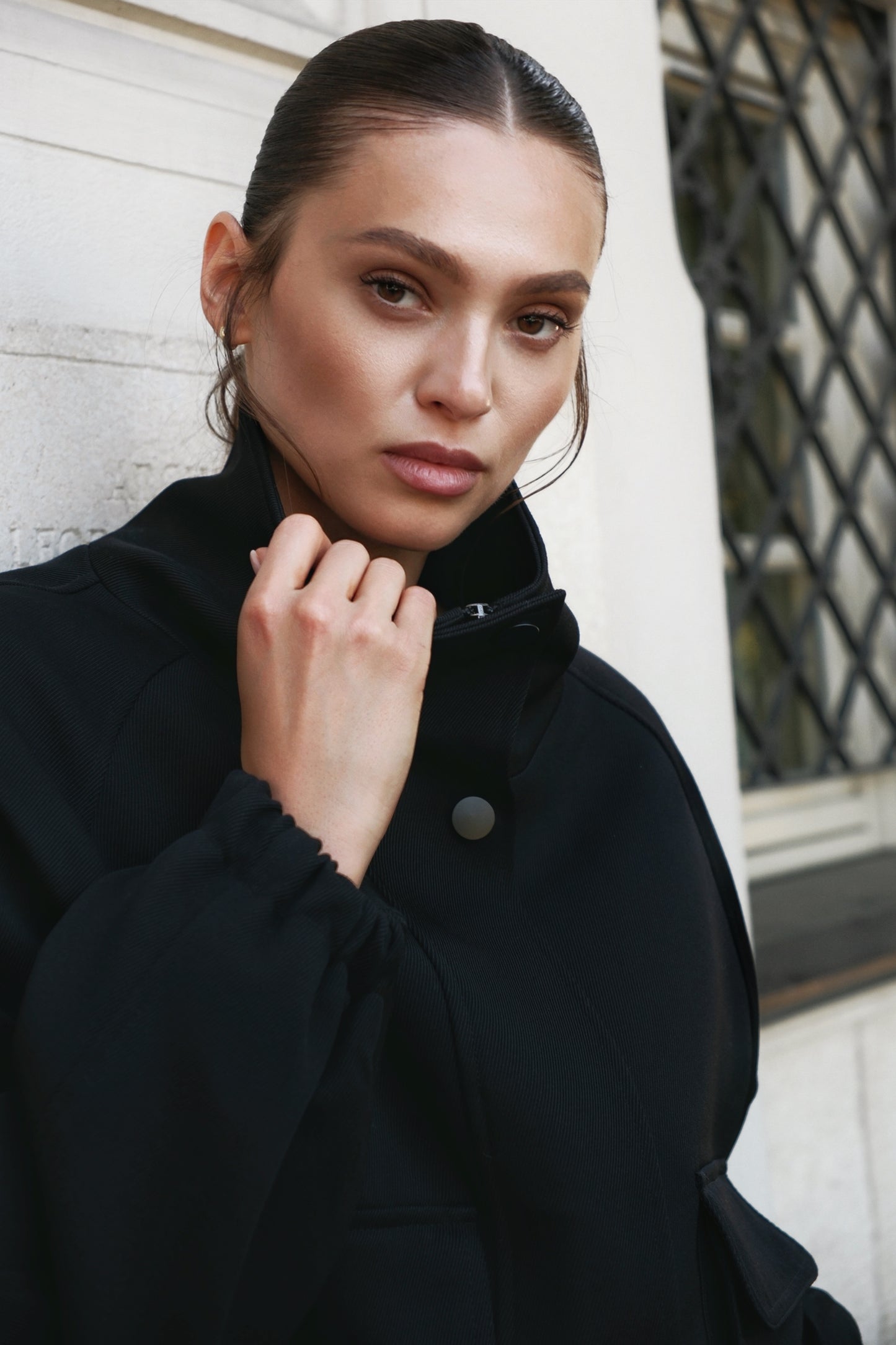 High neck insulated bomber jacket in black structured virgin wool