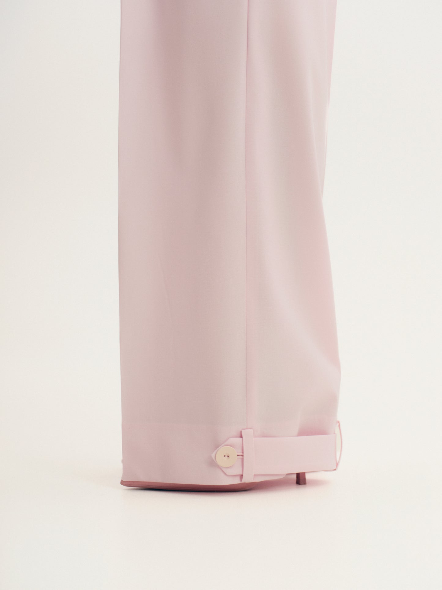 Wide-leg statement color wool pants with accent convertible hem