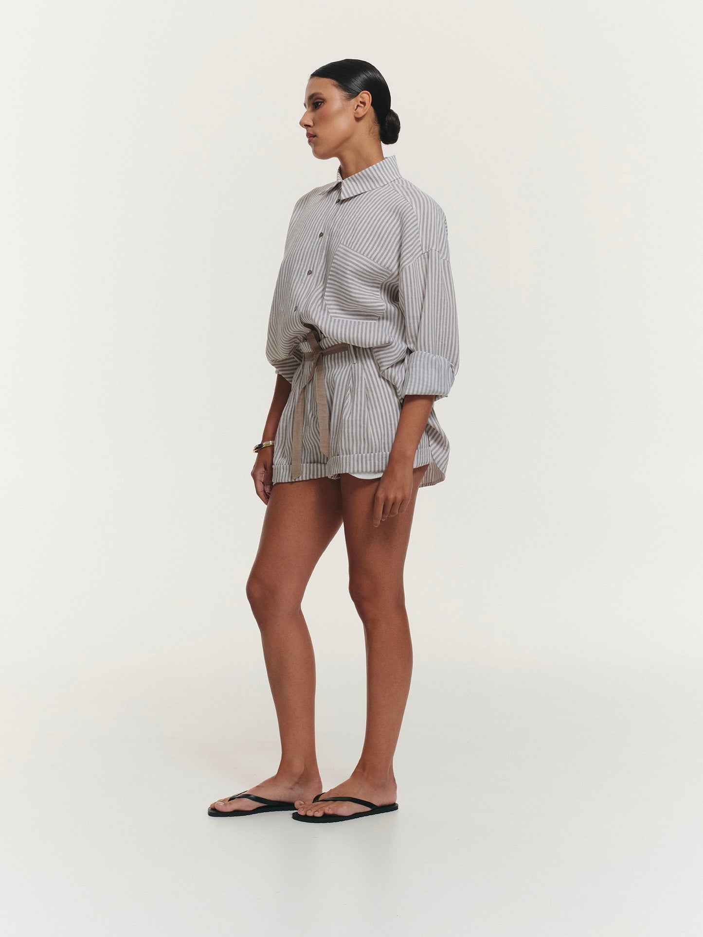 Two-piece stripped linen set with relaxed fit shirt and shorts
