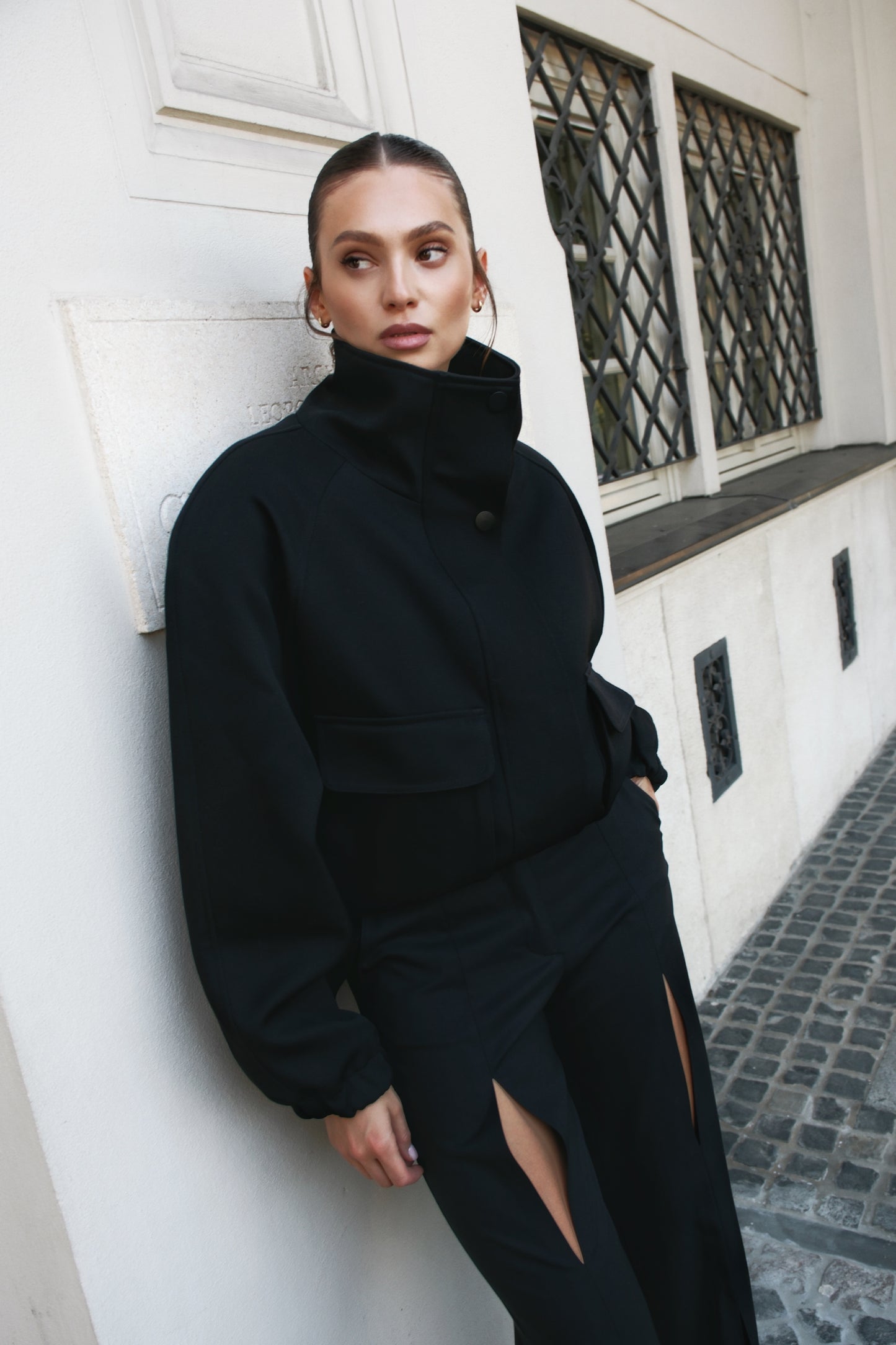 High neck insulated bomber jacket in black structured virgin wool
