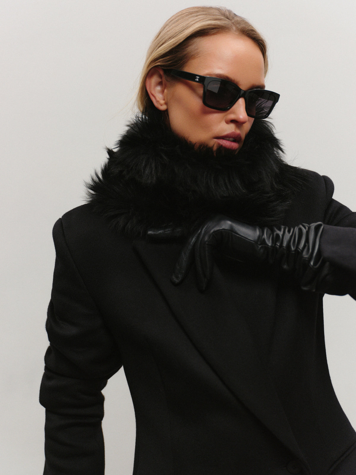 Elen slim fit mid-length coat in premium black wool with convertible collar and additional fur accessory