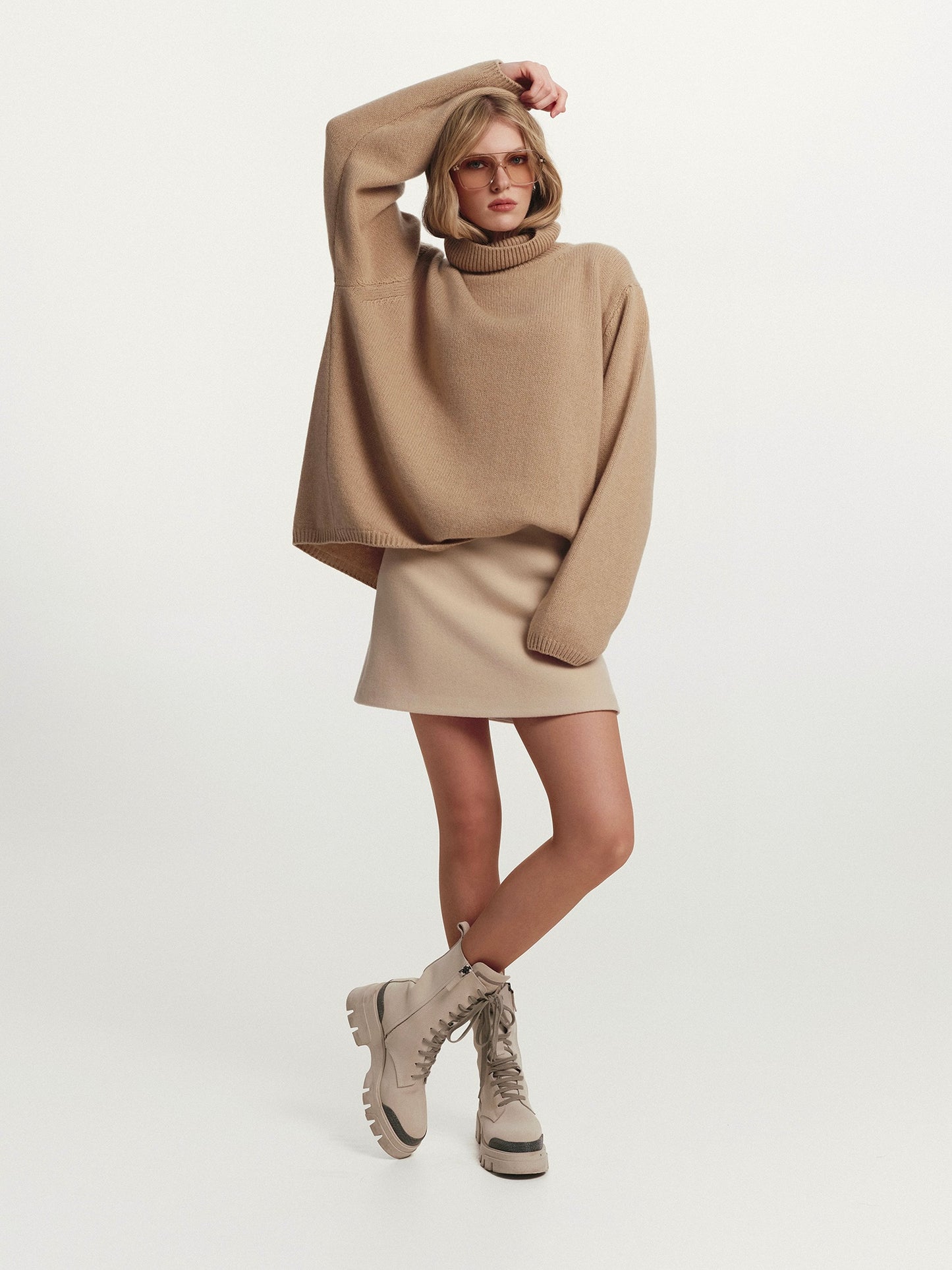 High-rise neckline oversized cashmere sweater in warm beige