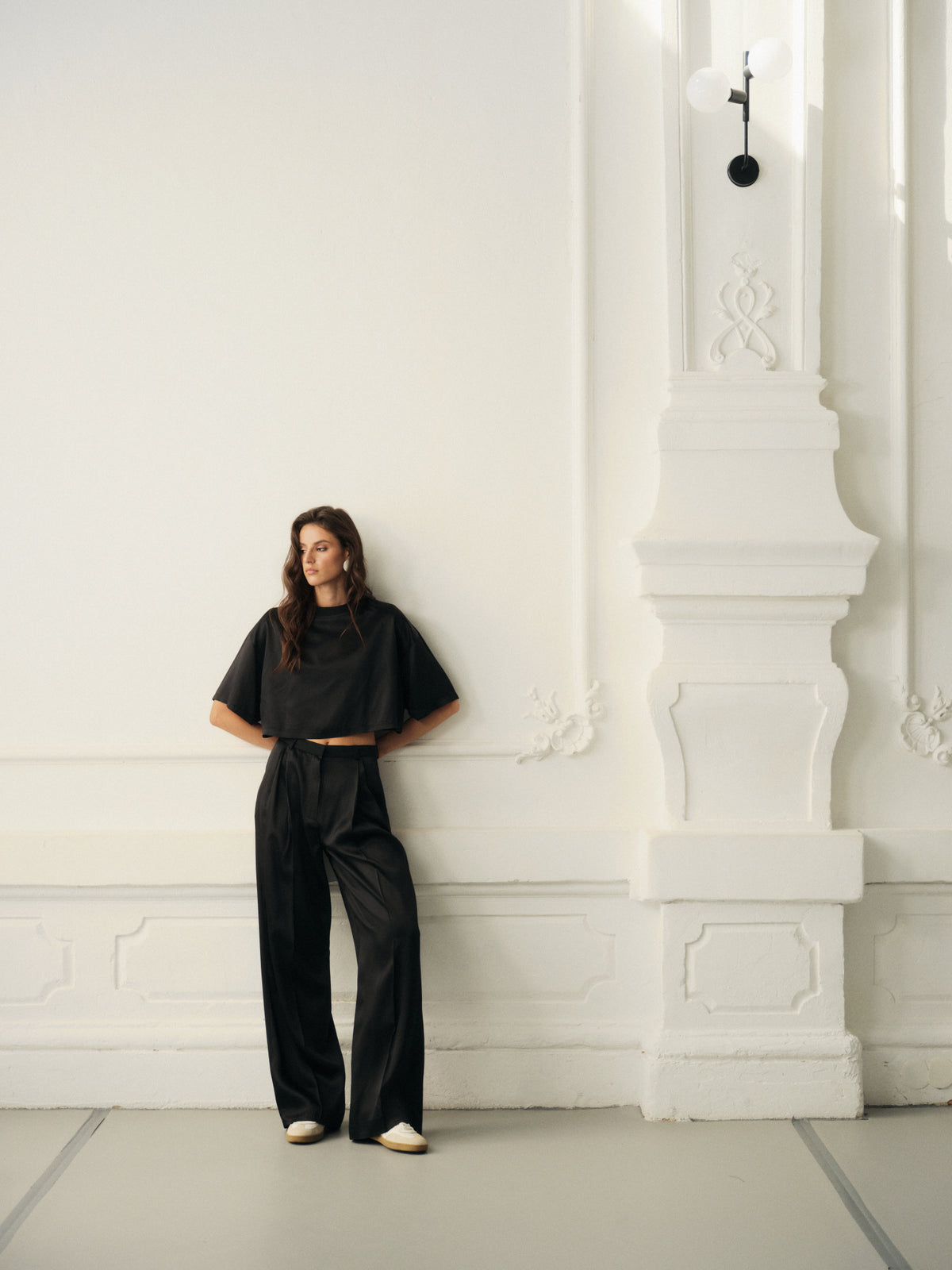 Wide leg pants and oversized crop top in fine black wool with contrast satin front
