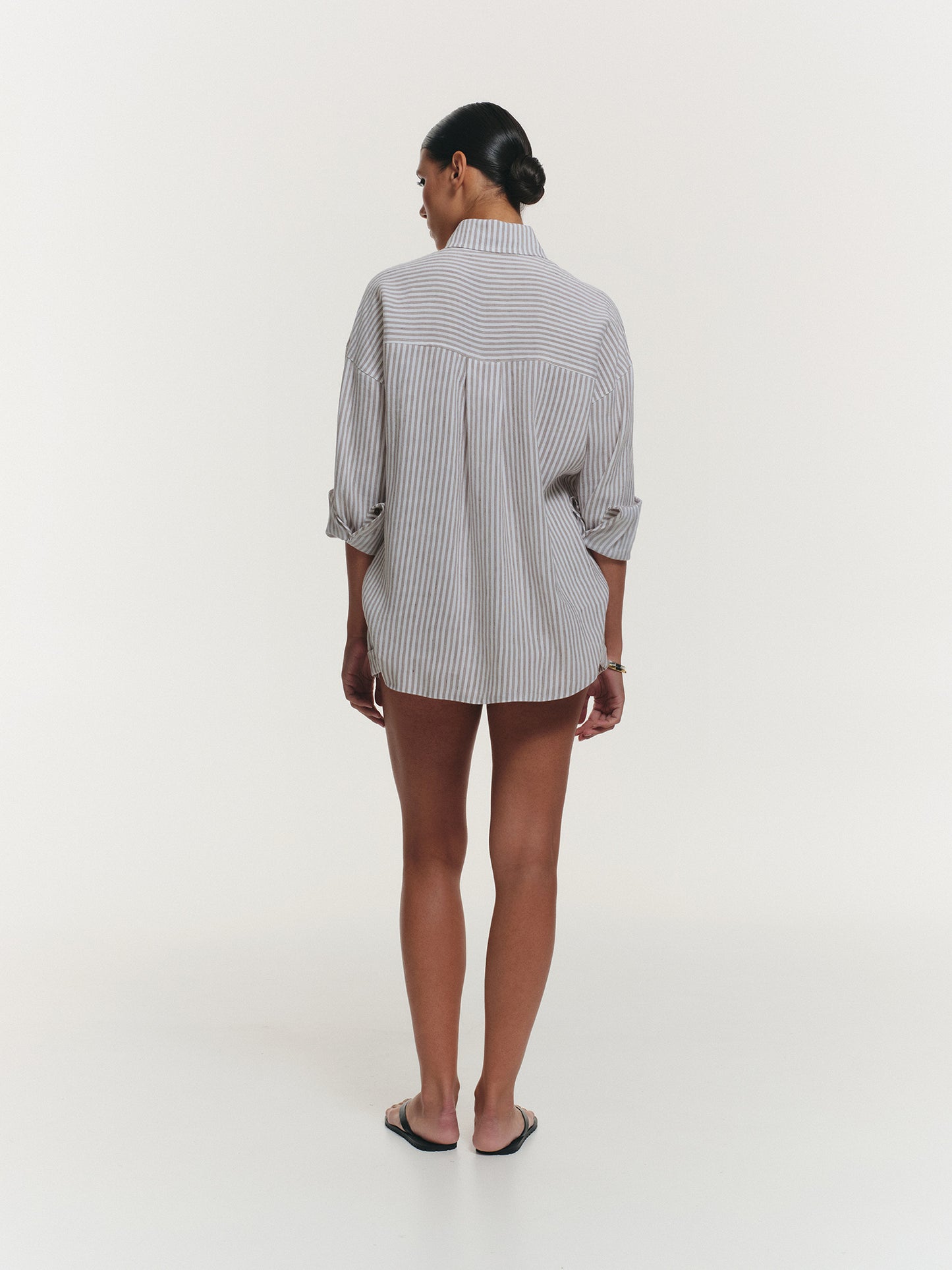 Two-piece stripped linen set with relaxed fit shirt and shorts