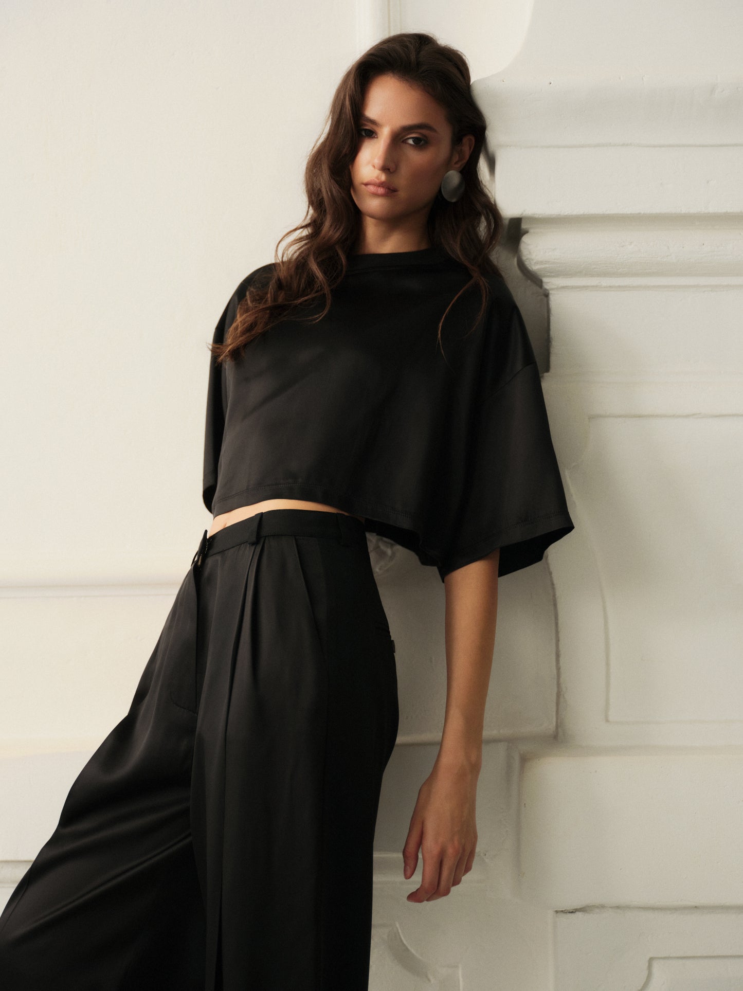Wide leg pants and oversized crop top in fine black wool with contrast satin front