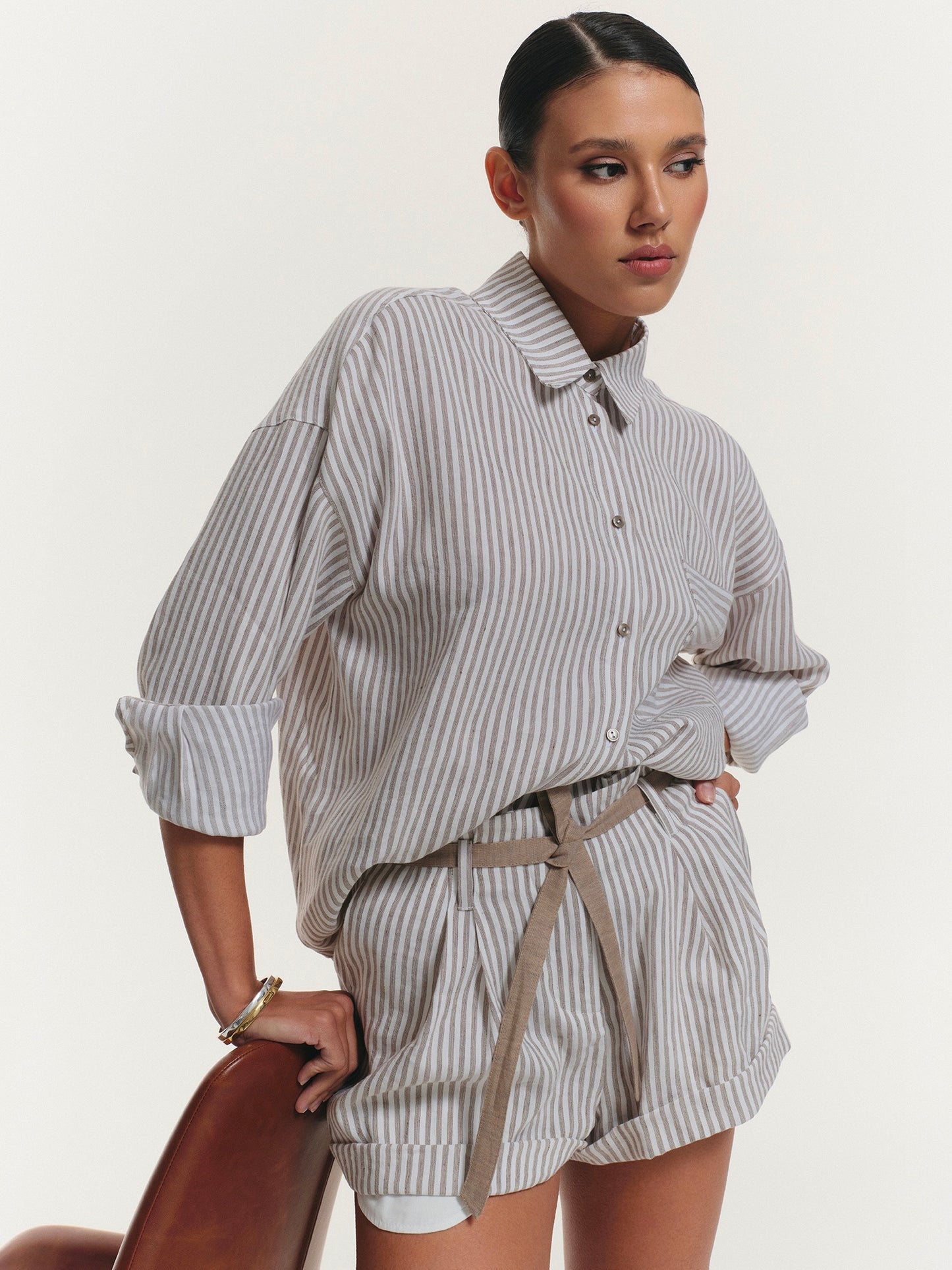 Two-piece stripped linen set with relaxed fit shirt and shorts
