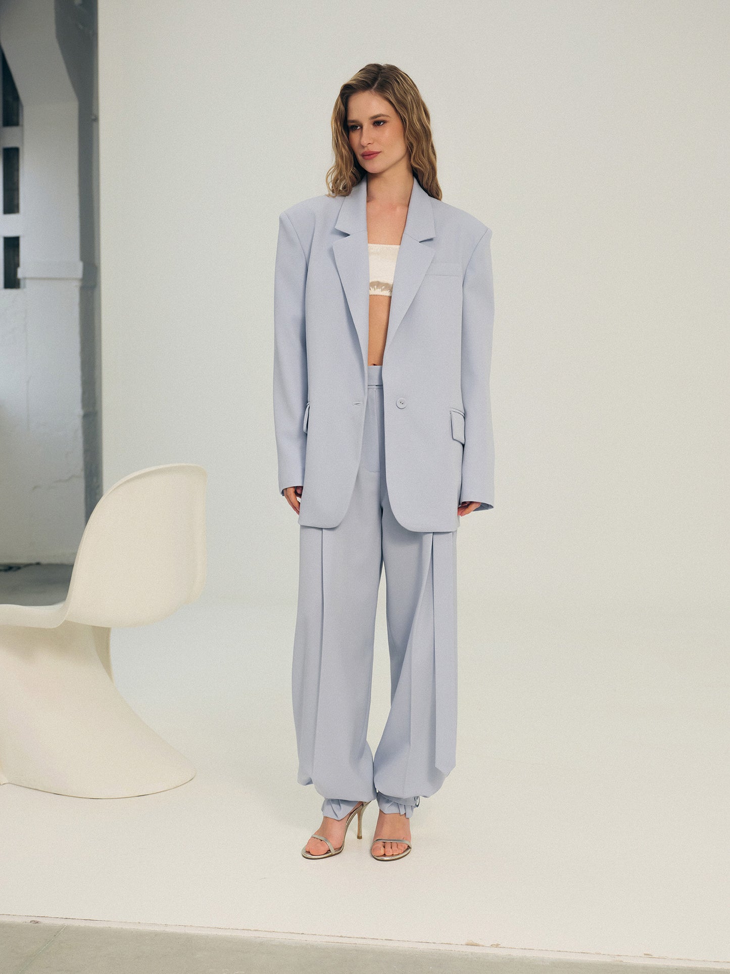Two-piece wool suit in statement ice-blue color with Ralph blazer and wide-leg pants with accent trim details