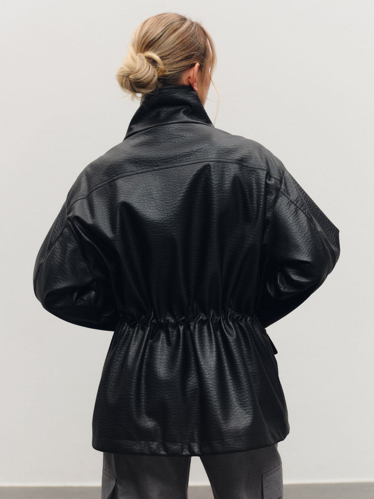 Trending eco-leather utility jacket with high-neck collar