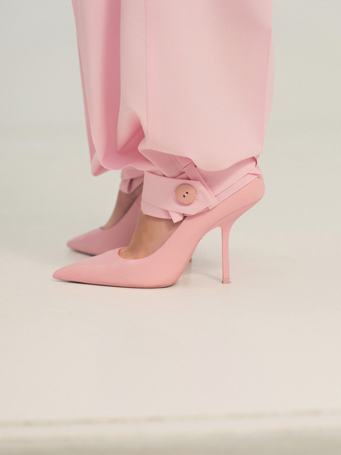 Wide-leg statement color wool pants with accent convertible hem