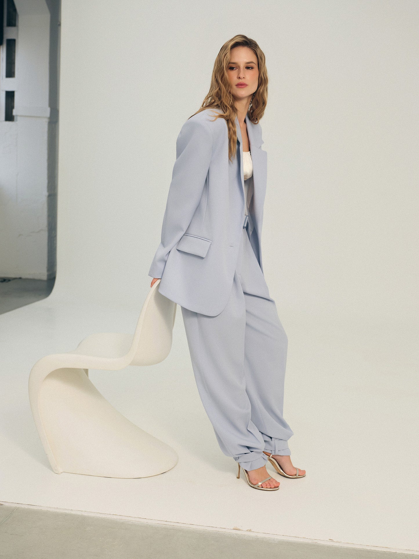Two-piece wool suit in statement ice-blue color with Ralph blazer and wide-leg pants with accent trim details