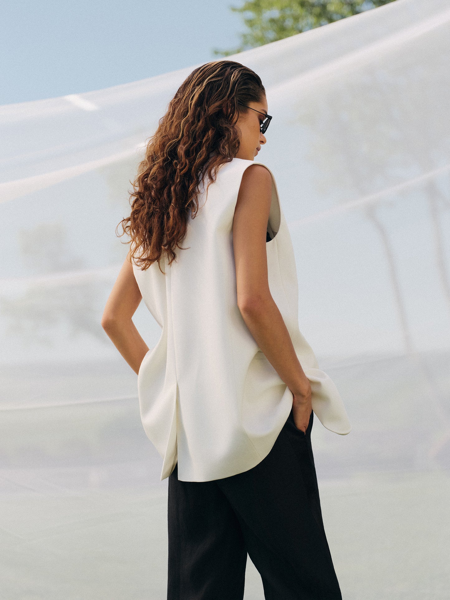 Loose fit sleeveless jacket in milk wool