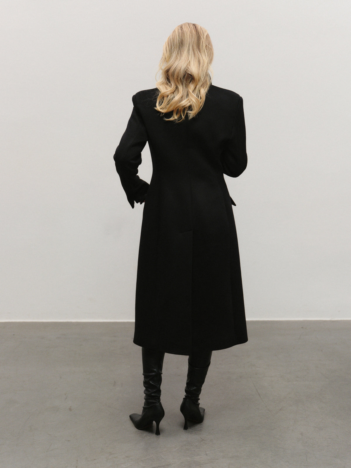 Elen slim fit mid-length coat in premium black wool with convertible collar and additional fur accessory