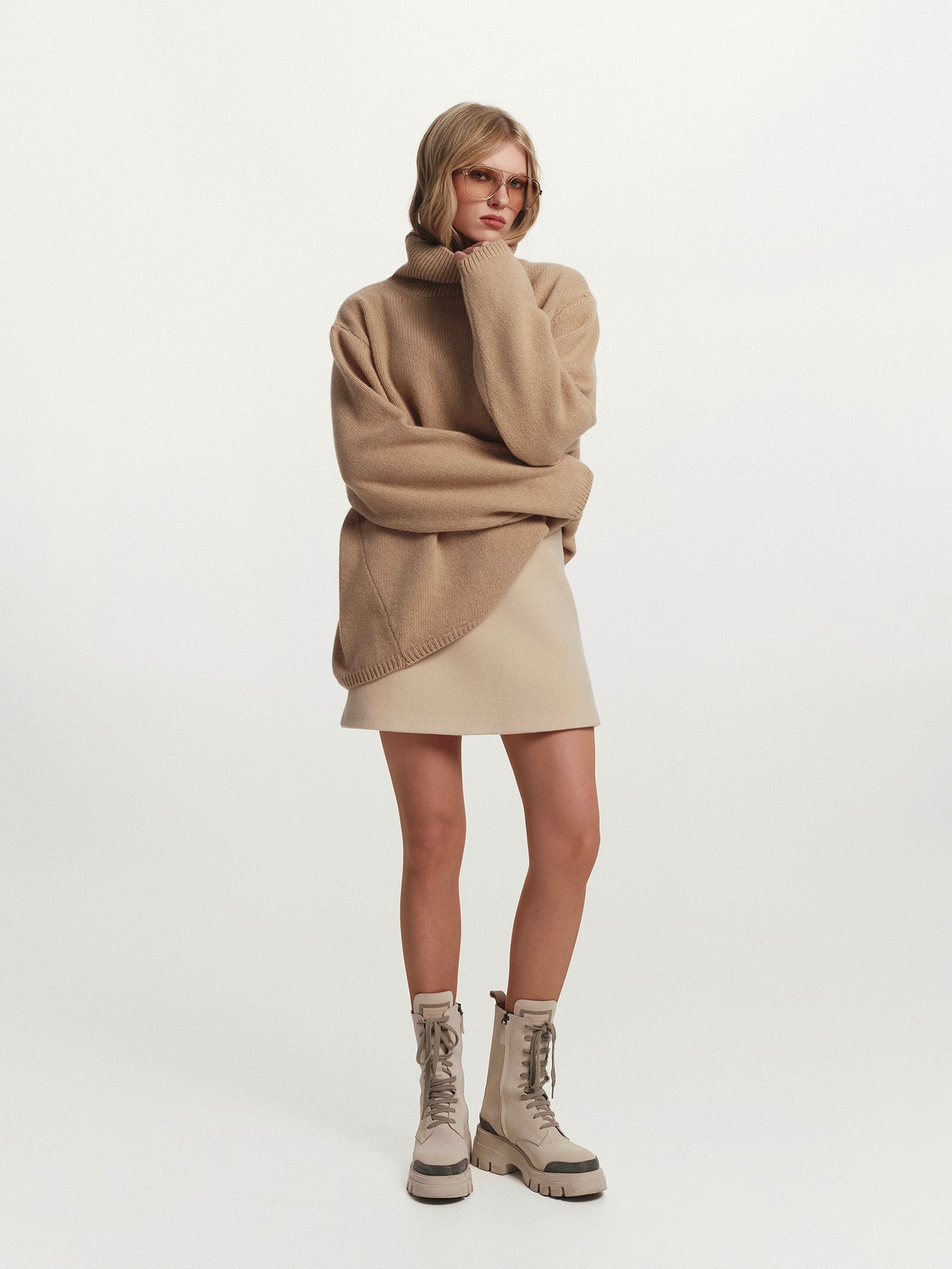 High-rise neckline oversized cashmere sweater in warm beige
