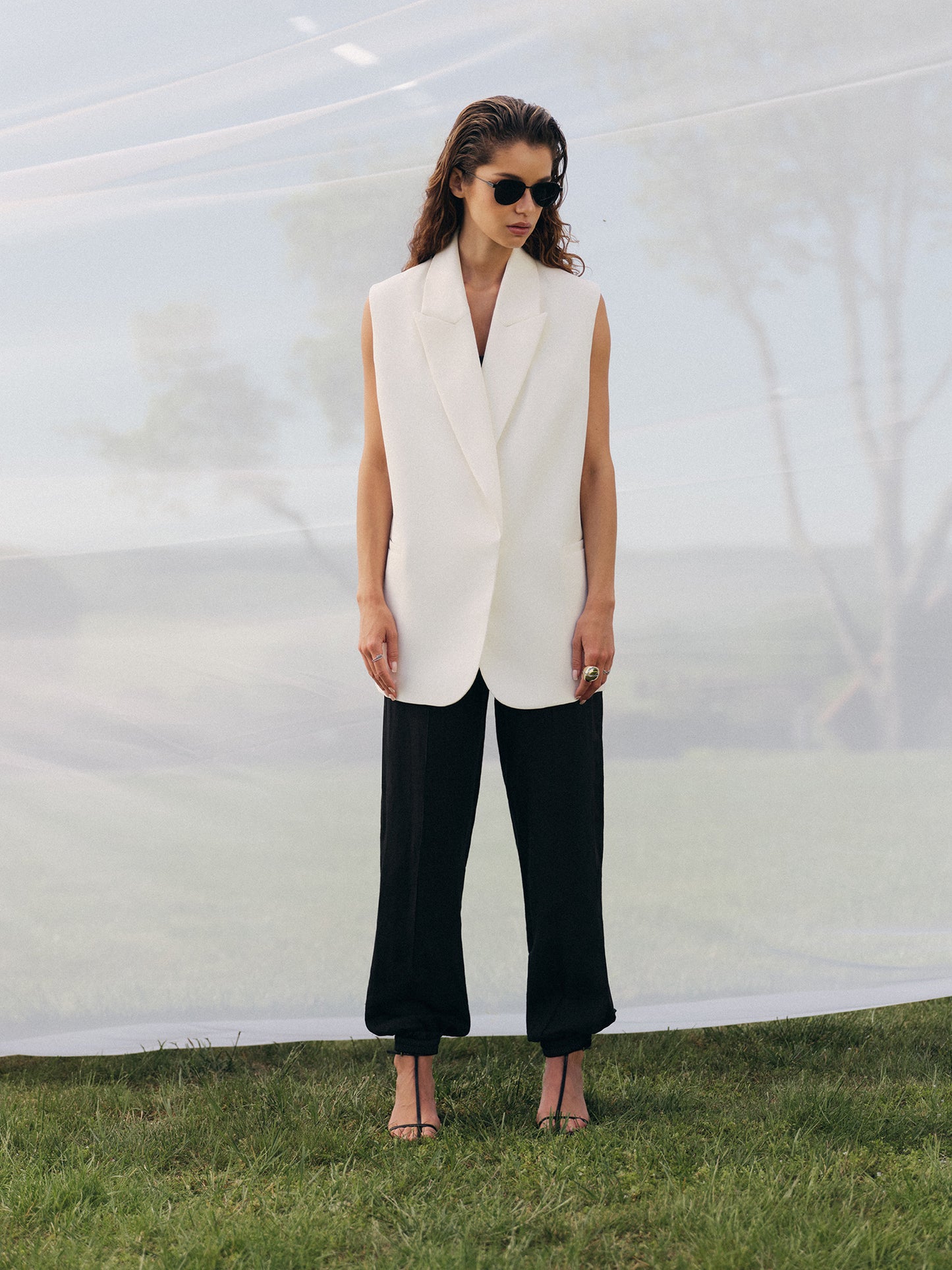 Loose fit sleeveless jacket in milk wool