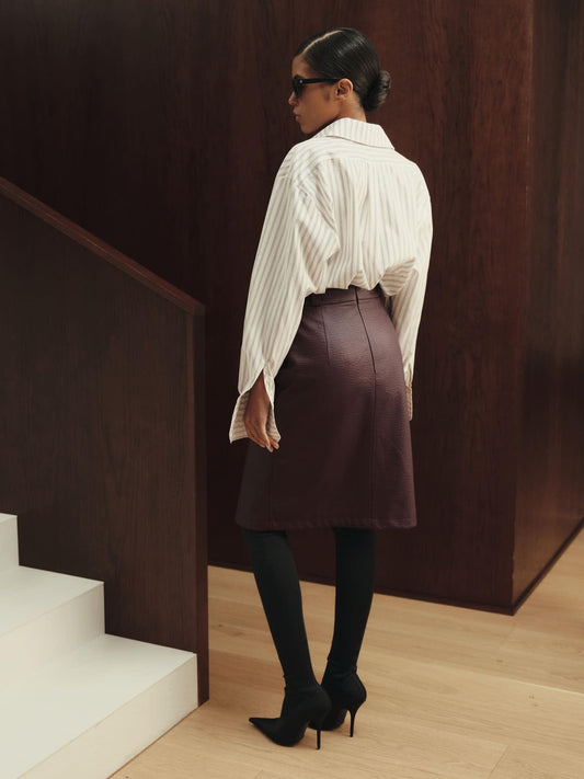 Vegan leather knee-length skirt with front cut