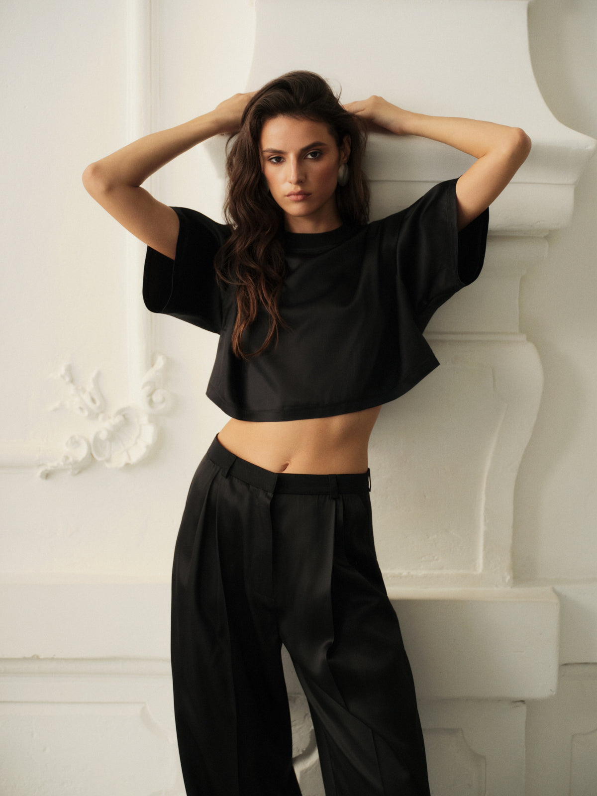 Wide leg pants and oversized crop top in fine black wool with contrast satin front
