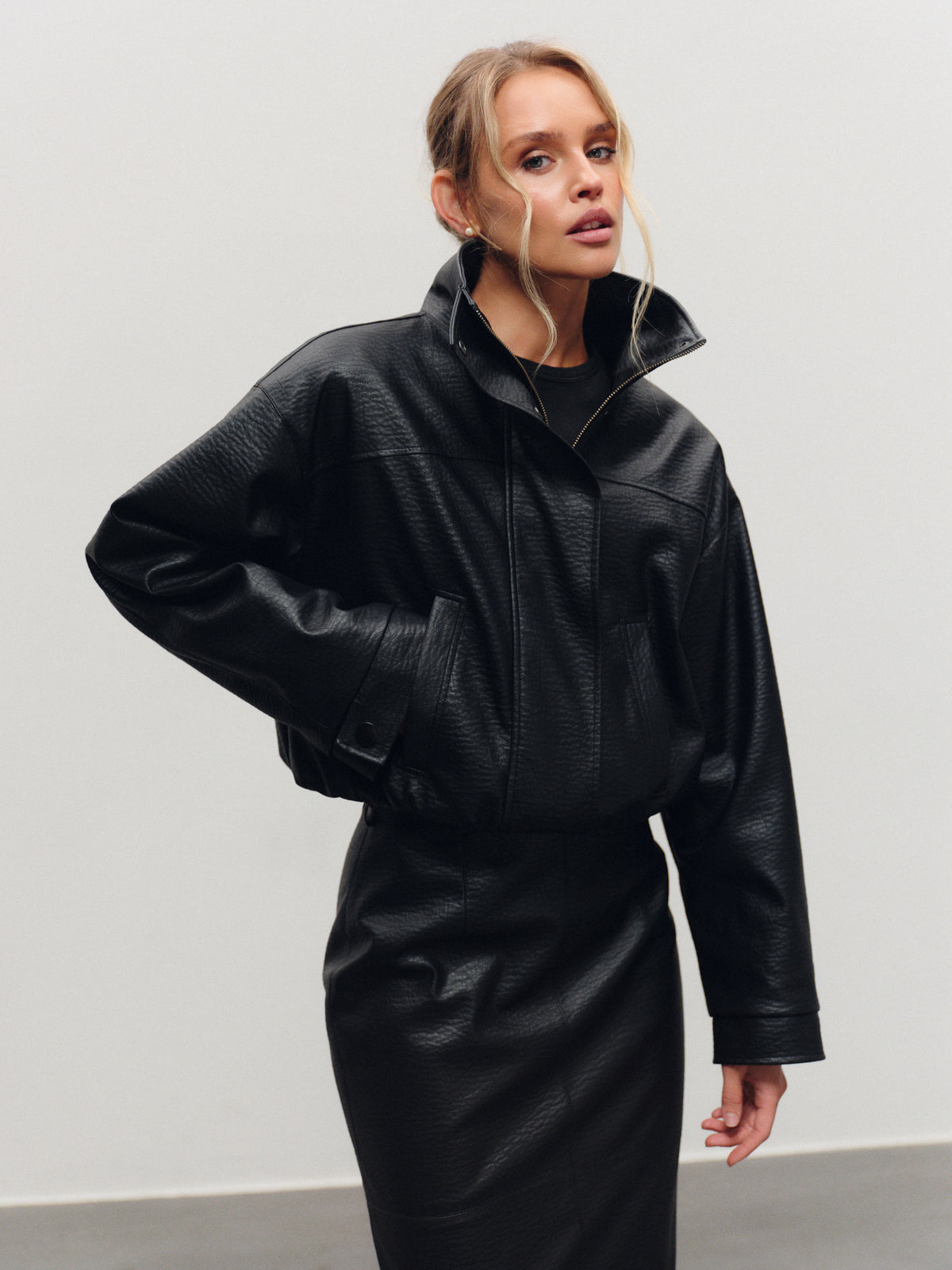 Insulated bomber jacket in black vegan leather